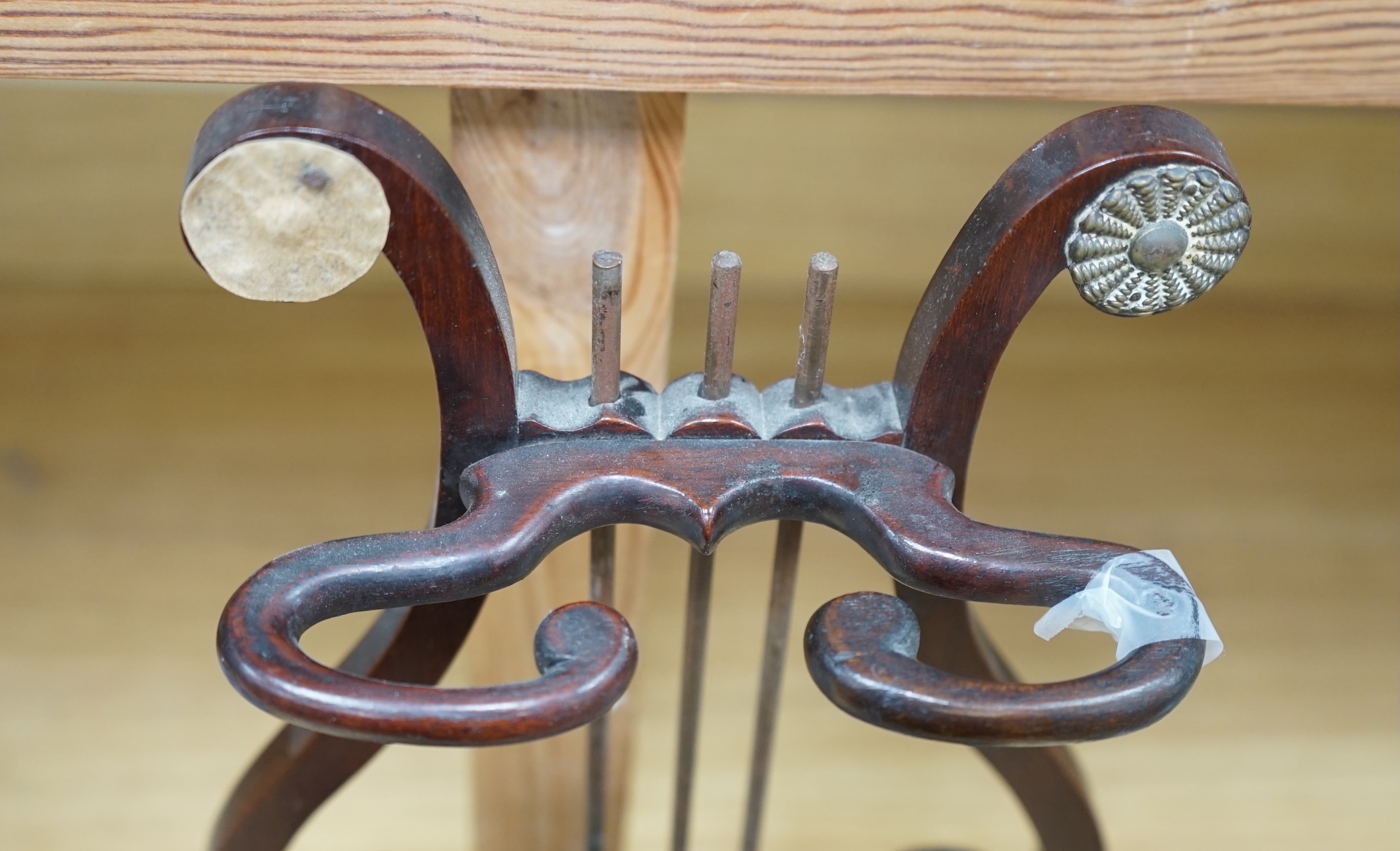 A rare Regency mahogany clay pipe stand, the lyre shaped back over a tobacco draw, 45cm tall. Condition - poor